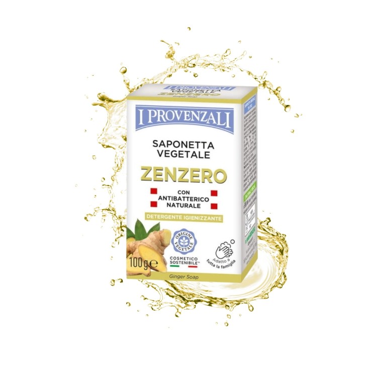 I Provenzali Saponetta Vegetale Zenzero mydło antybakteryjne z imbirem - opakowanie 100g na tle złotych pryskających kropel wody.