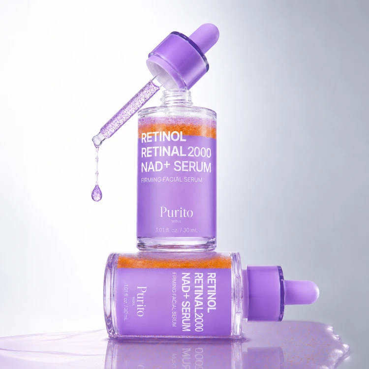 Purito Seoul Retinol Retinal 2000 NAD+ Serum - fioletowa buteleczka z pipetą, widok produktu w działaniu z kroplą serum.